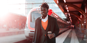 Man standing in front of train