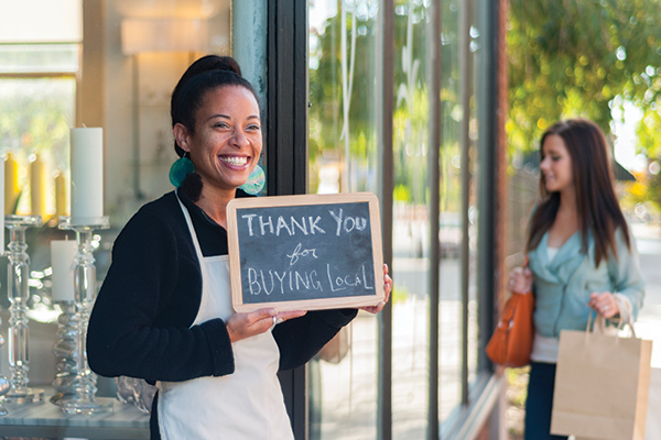 A woman holding a sign board